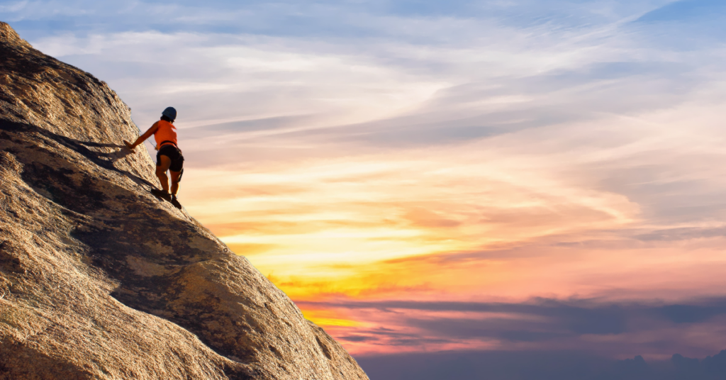 Woman climbing mountain